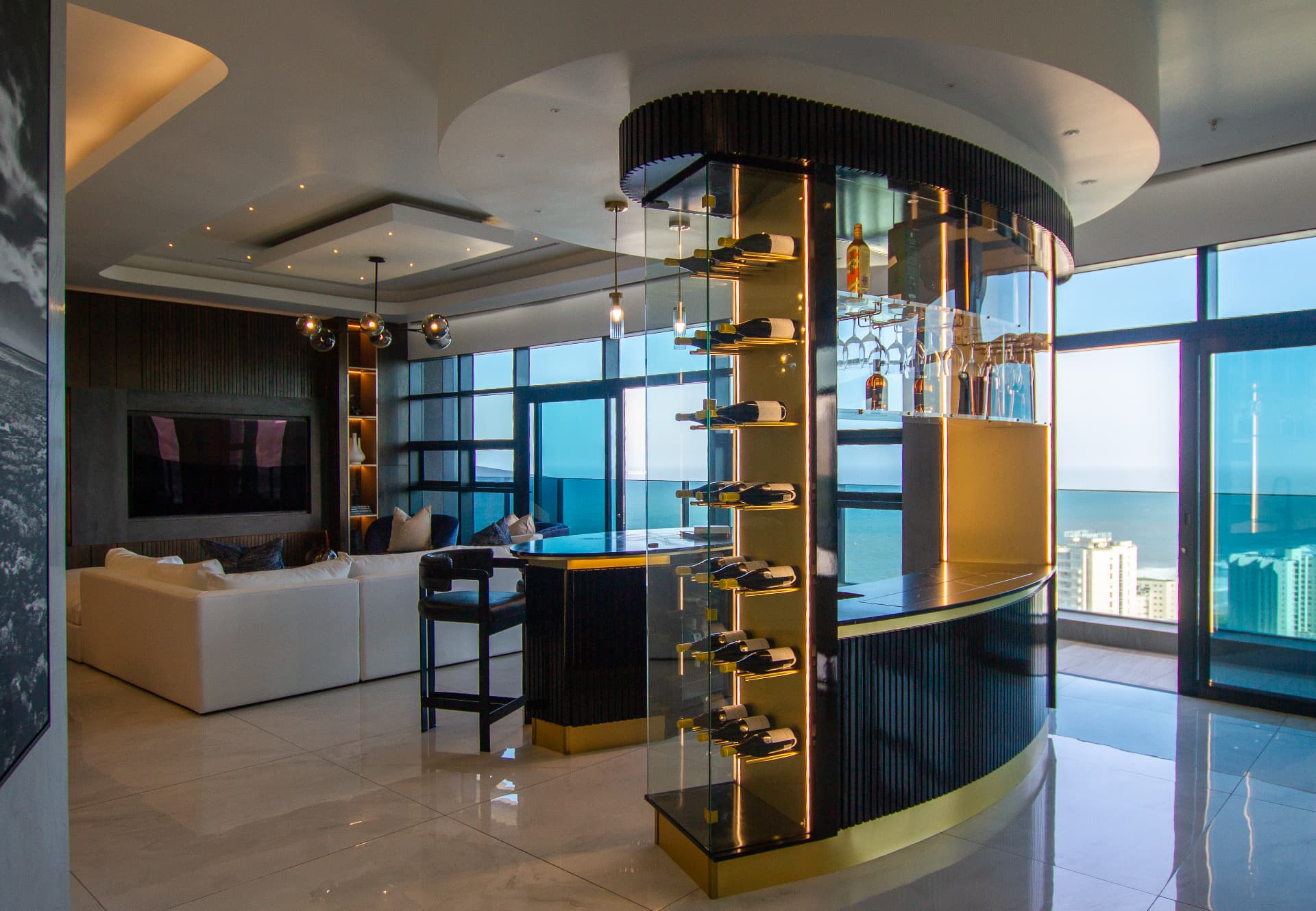 Ocean1 penthouse lounge with curved glass wine bar and sea views