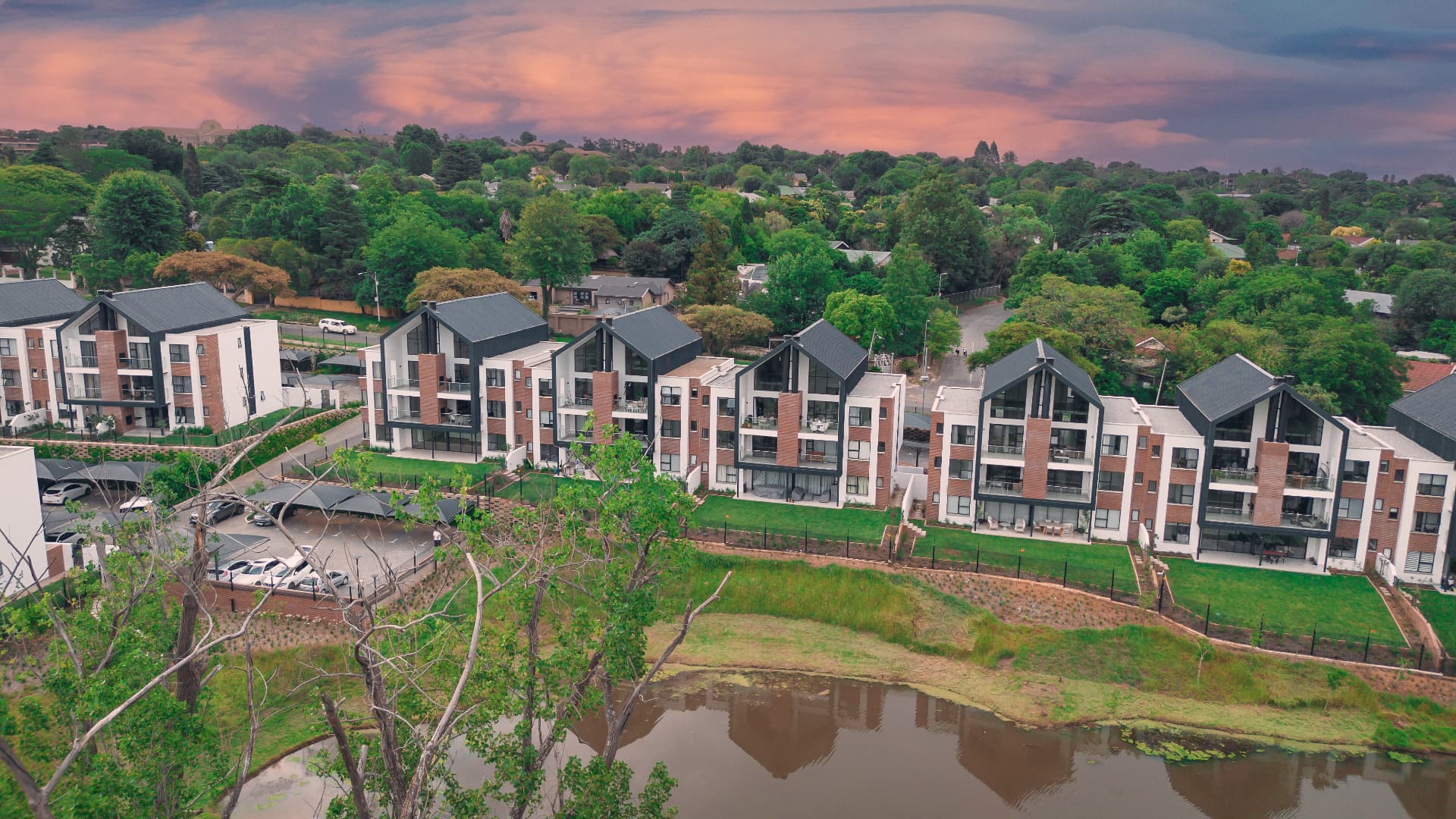 Aerial view of the Tricolt Brookfield residential development at sunset