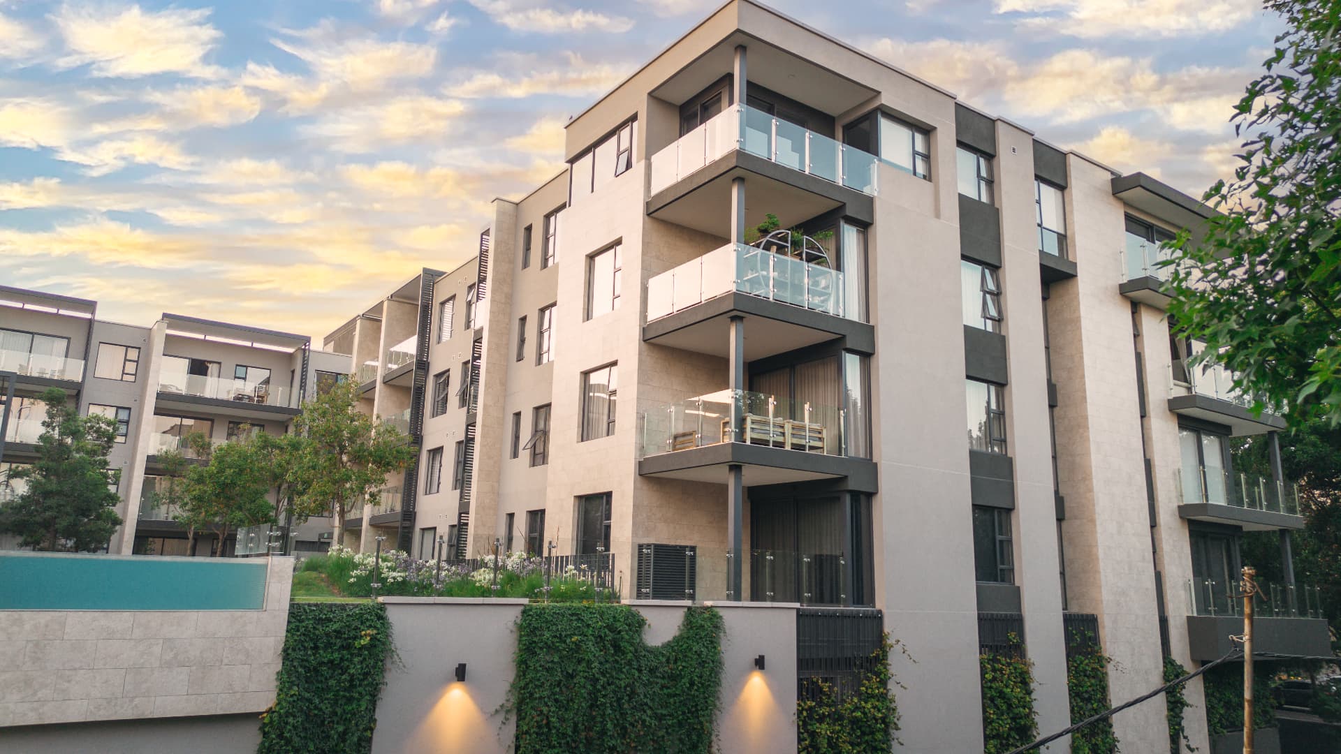 Aerial view of the Tricolt Tree Tops apartments at golden hour